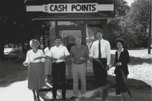 Employees standing in front of first CashPoints ATM