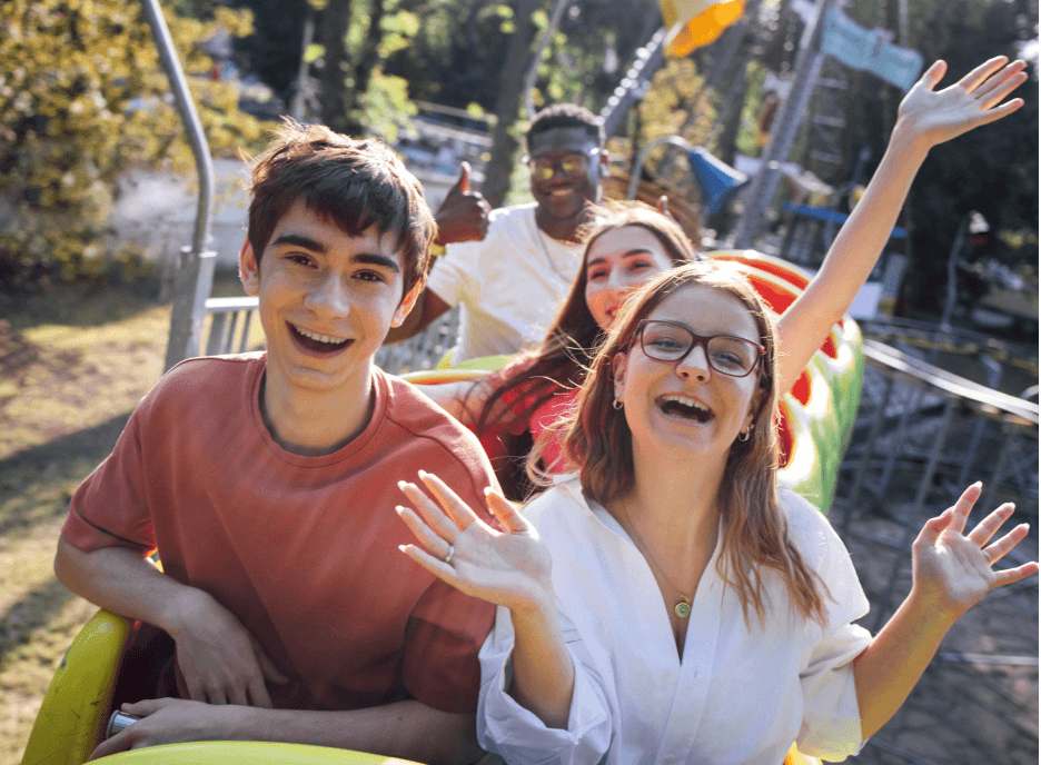 People riding a roller coaster