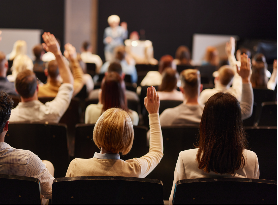 Group of members raising their hands