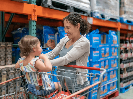 Mom with daughter in a shopping cart