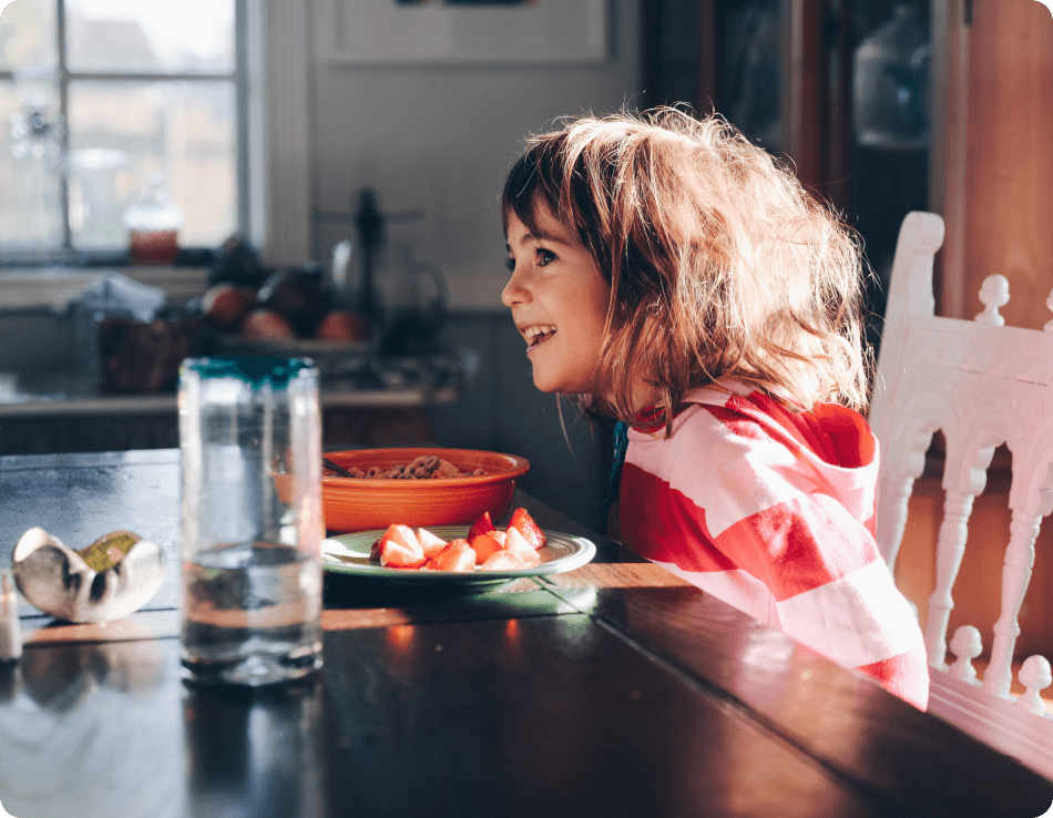 Young girl eating breakfast