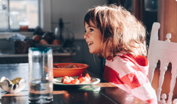 Young girl eating breakfast