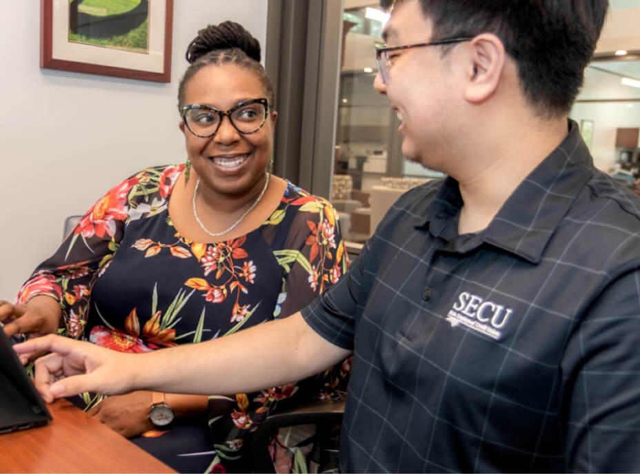 SECU employees smiling and working