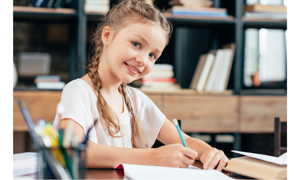 Young school girl doing work