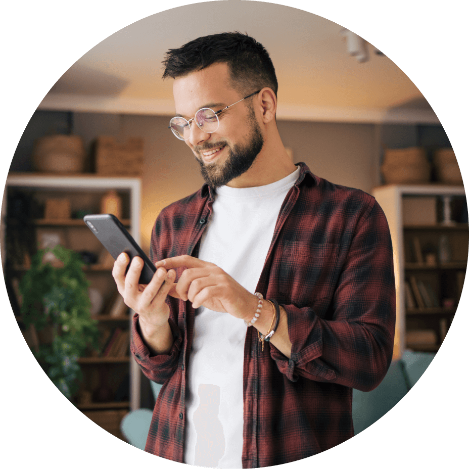 Man looking at phone and smiling