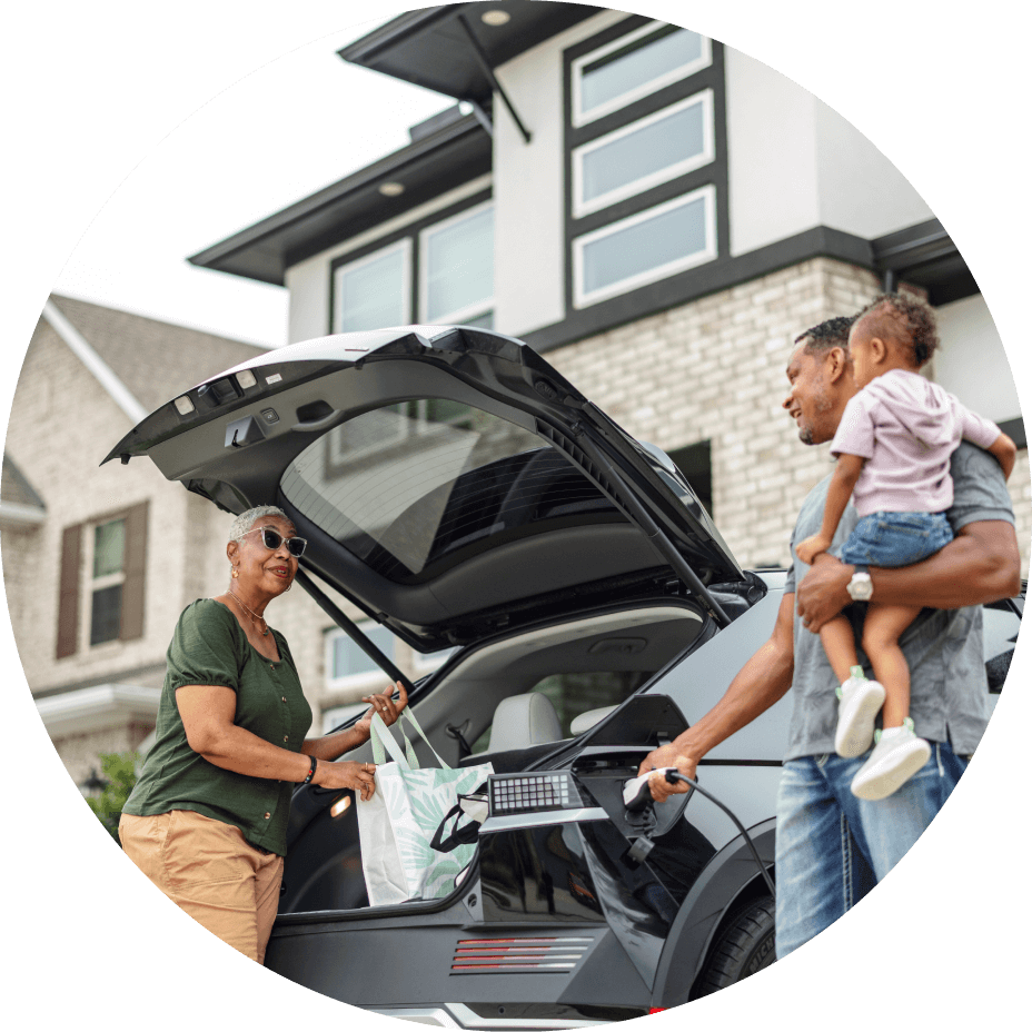 Elderly couple at trunk of car