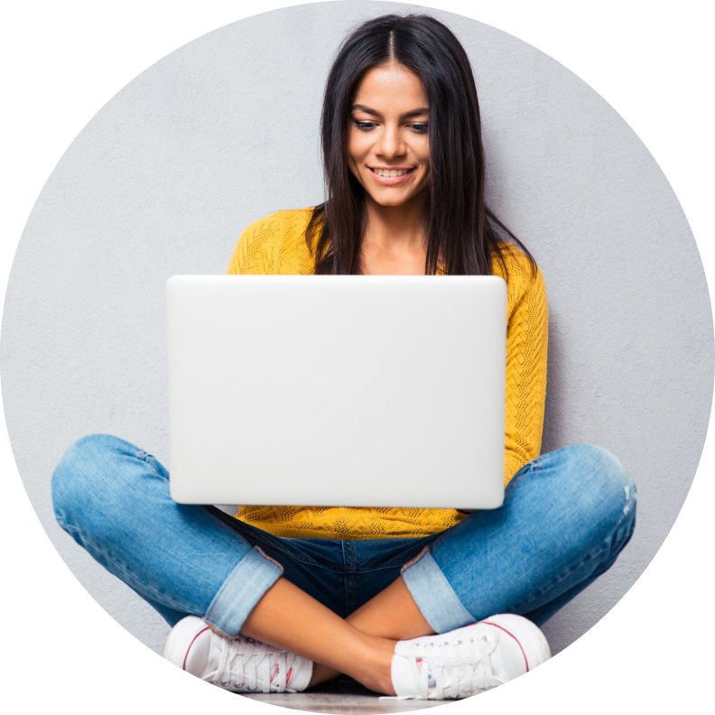 teen girl sitting with laptop