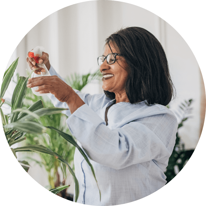 Lady watering plant