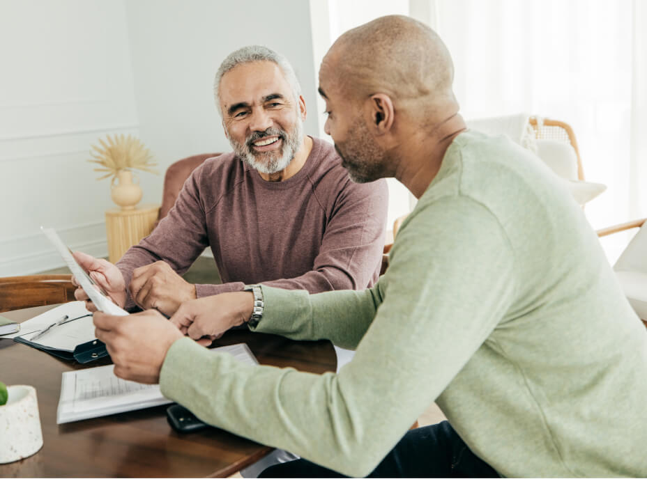 two older men talking finances