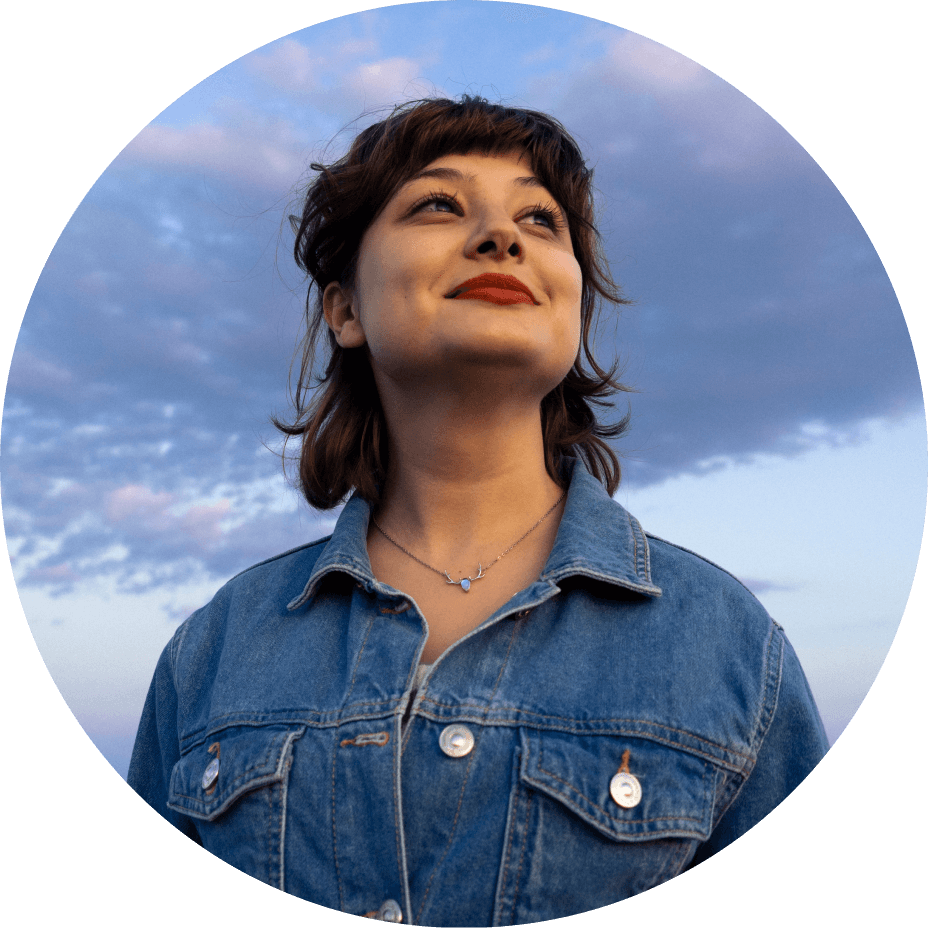 lady in denim shirt with sky background