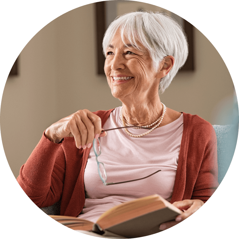 Elderly woman with glasses thinking