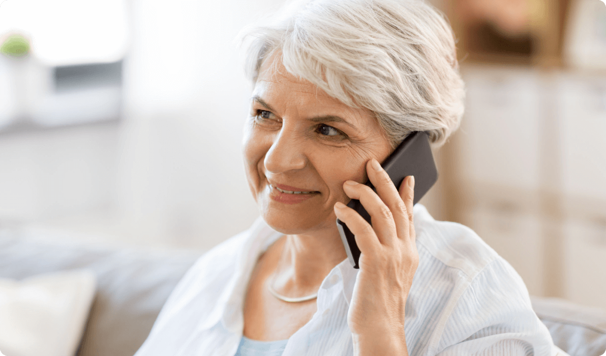 elderly lady listening on cell phone