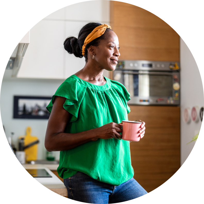 Girl drinking coffee in kitchen
