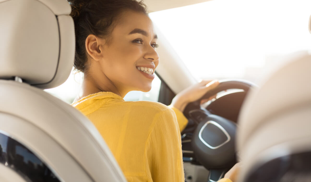 young girl driving car