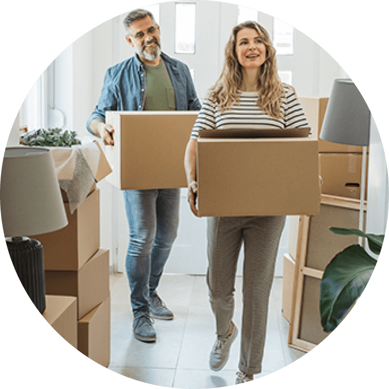 couple holding moving boxes