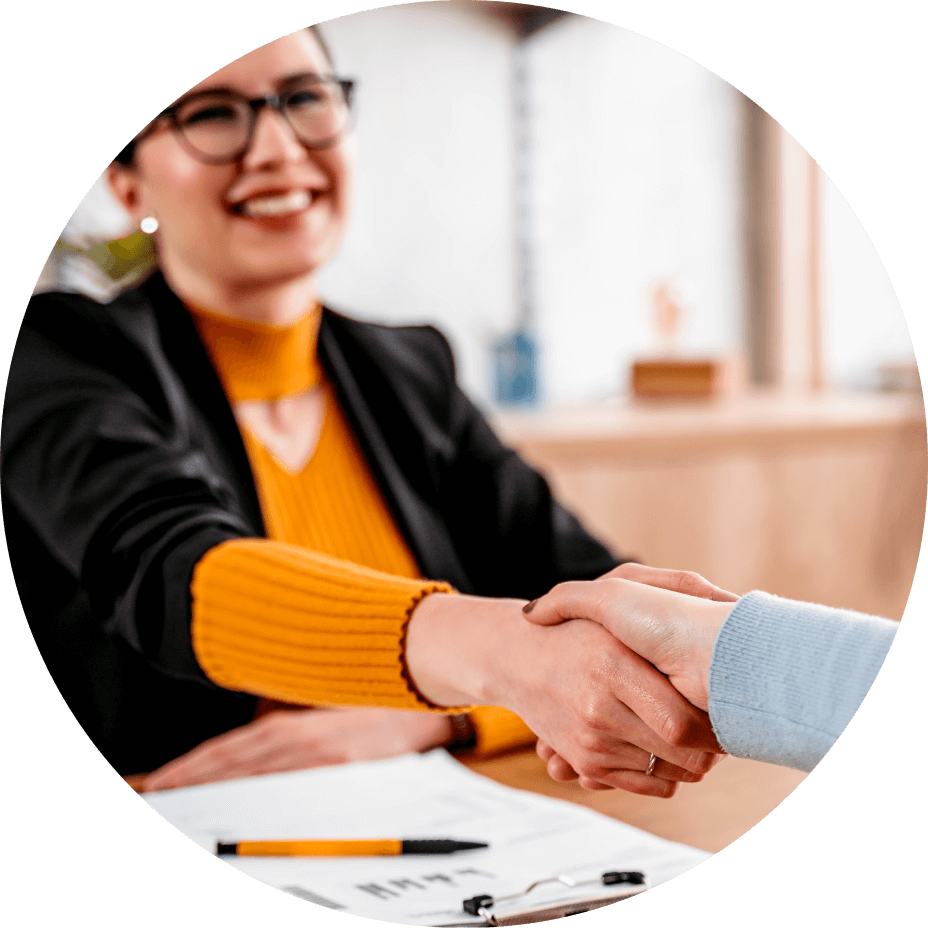 lady shaking hand over desk
