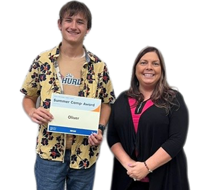 Summer Camp award winner Oliver with Employee
