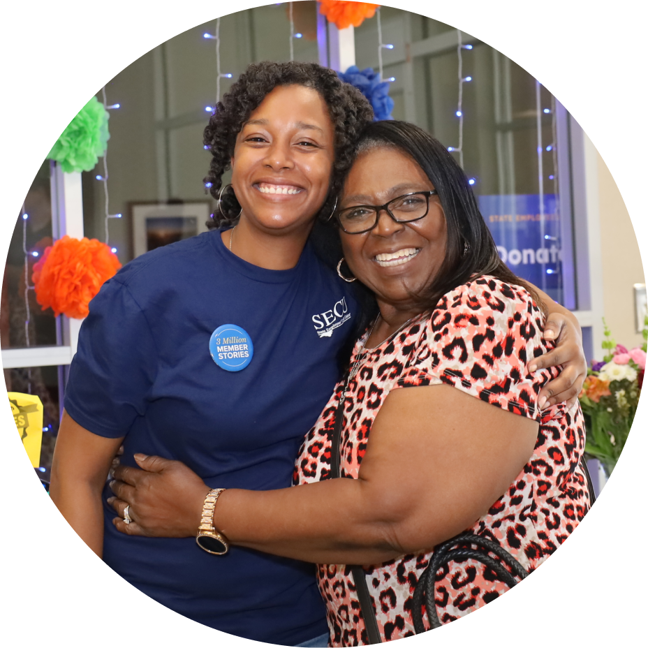 Member and Employee hugging