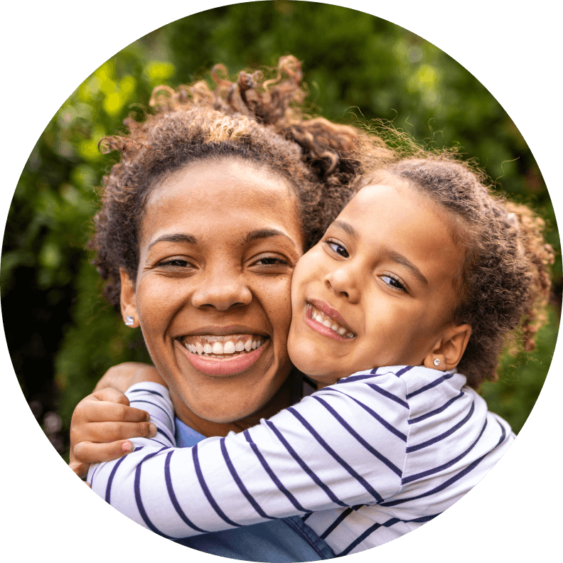 Close up of woman hugging child
