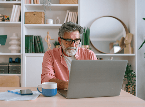 man looking at computer and thinking