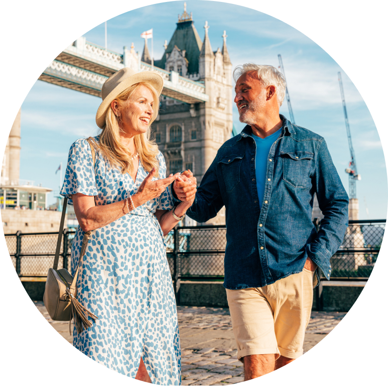 Happy couple walking infront of old European architecture
