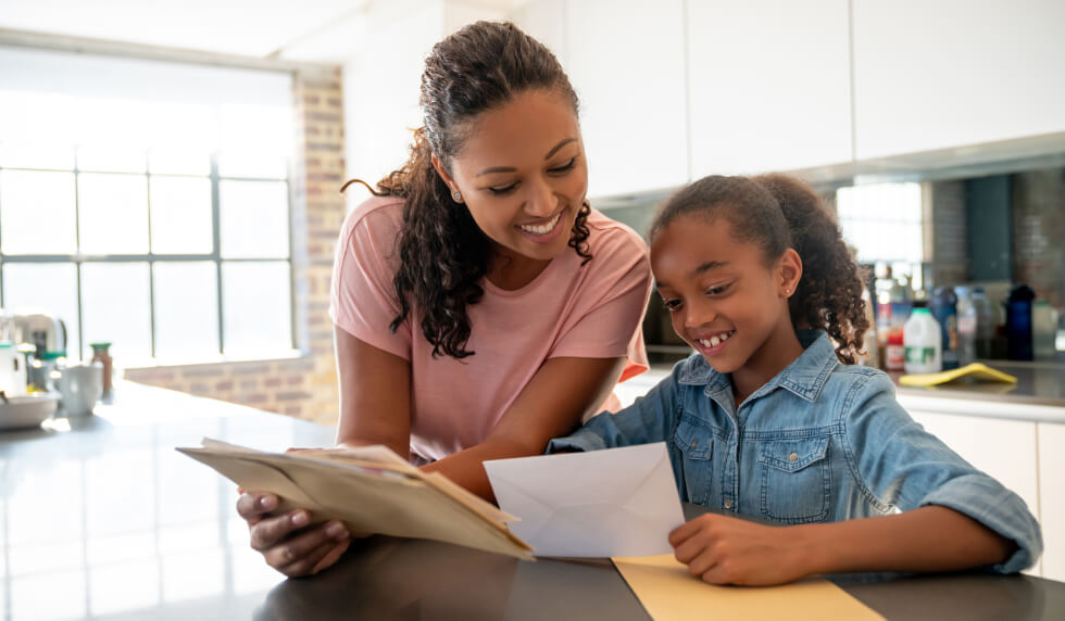 Mom helping child with schoolwork