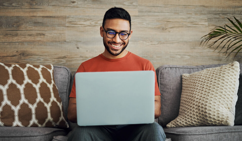 Man Looking at computer for rewards options