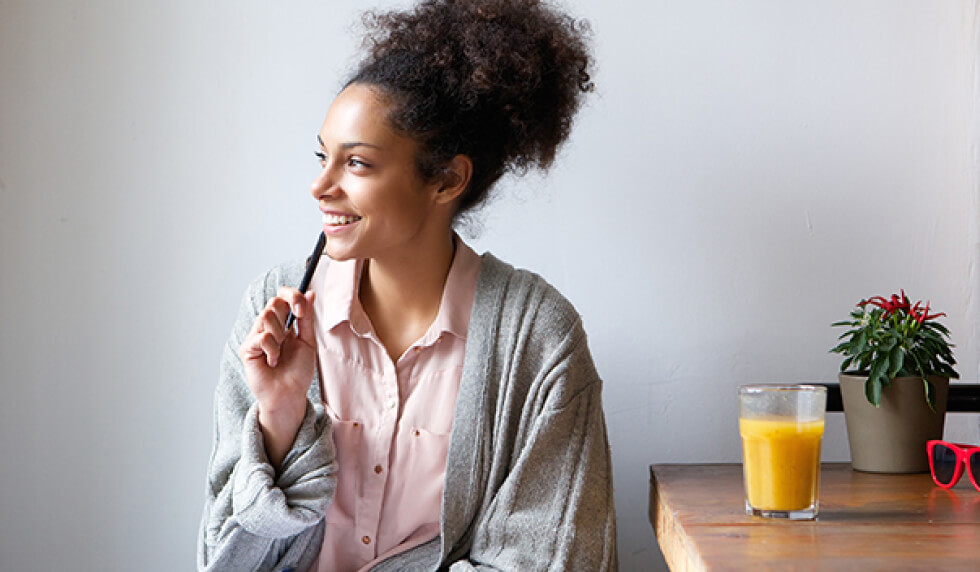 lady thinking with pen in hand