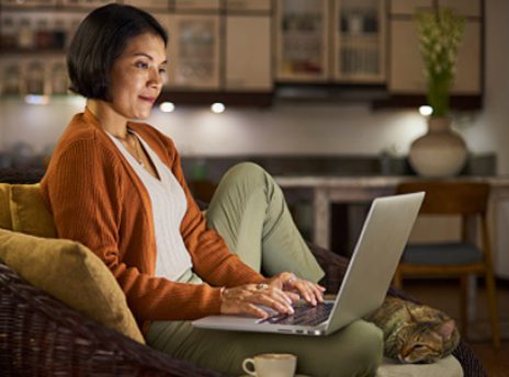 Women looking at her laptop at home