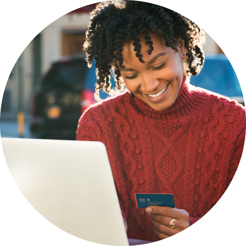 young woman with credit card and computer