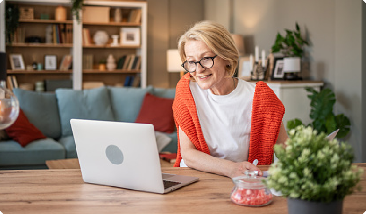 Elderly lady looking at laptop